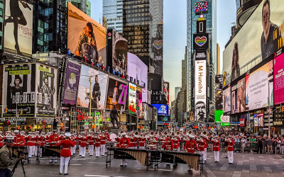 The Marine Corps Band plays during Fleet Week in Times Square at Night