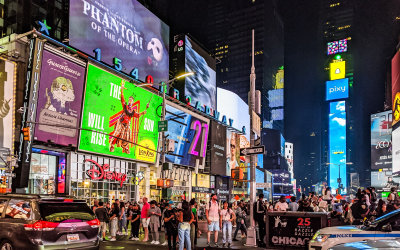 Video billboards and crowds in Times Square at Night