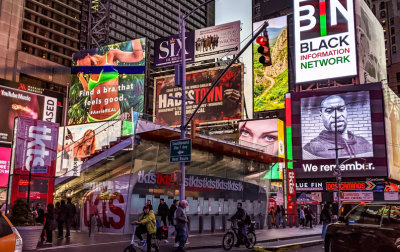 Bras, plays and social issues displayed together in Times Square at Night
