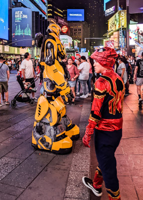 Transformer and an overheated Spiderman in Times Square at Night