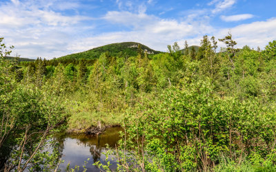 Hills and mountains viewed over a pond in Baxter State Park