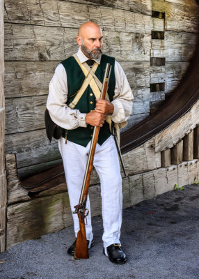 Militiaman standing inside the fort drawbridge in Fort Stanwix NM