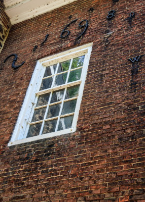 ‘1698’ scripted in iron on the side of the Old Swedes Church in First State NHP