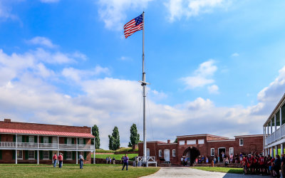 Fifteen-star flag flies over the parade ground in Fort McHenry NM and HS