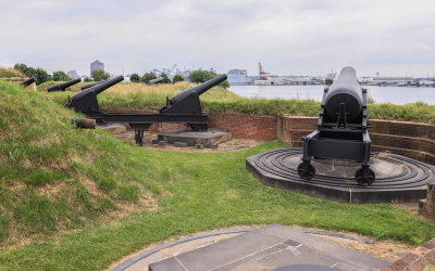 Numerous cannons mounted on a bastion in Fort McHenry NM and HS