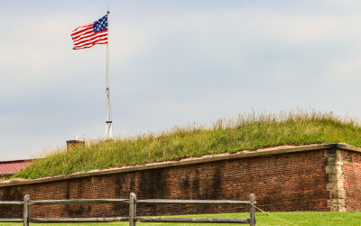 Fifteen-star flag flying above the fortress in Fort McHenry NM and HS