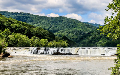 View of Sandstone Falls, spanning 1,500 feet across the river, from the boardwalk in New River Gorge National Park