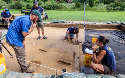 Archeology team excavating and area outside the original James Fort footprint at Jamestown in Colonial NHP