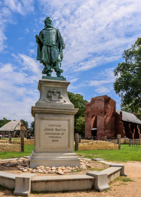 Statue of Captain John Smith with brick church tower in the background at Jamestown in Colonial NHP