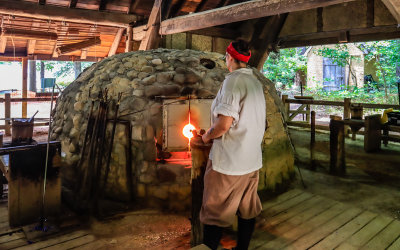 Glassworks being made at a furnace near the Glasshouse Ruins at Jamestown in Colonial NHP