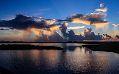 Clouds on the horizon lit up before sunrise on Bodie Island in Cape Hatteras NS 