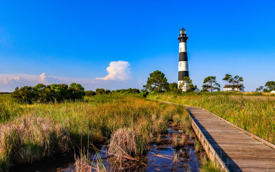 The Bodie Island Lighthouse against a blue morning sky in Cape Hatteras NS
