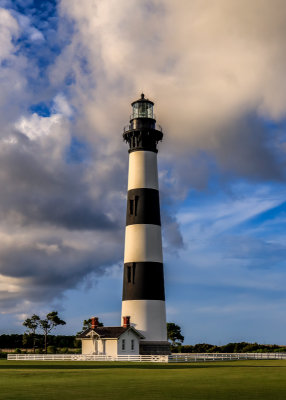 The Bodie Island Lighthouse with a cloudy backdrop near sunset in Cape Hatteras NS