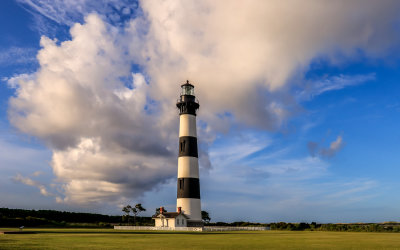 Clouds and blue skies at sunset highlight the Bodie Island Lighthouse in Cape Hatteras NS