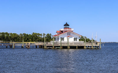 The Roanoke Marshes Lighthouse on a pier in Manteo, west of the Outer Banks