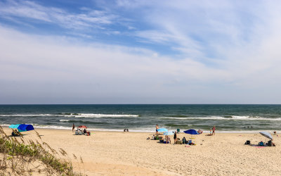 Families enjoy the sun, water and sand in the Outer Banks