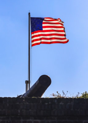 View of the 15-star flag flying above Fort Moultrie in Fort Sumter National Monument