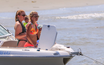 Boaters on a Charleston Harbor beach adjacent to Fort Sumter near Charleston South Carolina