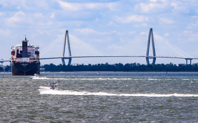 Container ship sails towards the Arthur Ravenel Jr Bridge near Charleston South Carolina