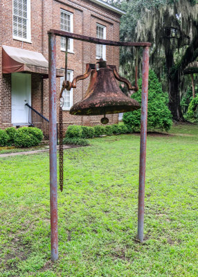 Bell in front of the Brick Baptist Church (1855) in Reconstruction Era National Historical Park