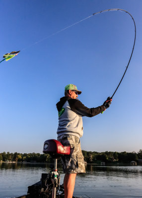A cast bows the rod as the bait flies through the air over Chickamauga Lake
