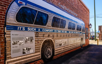 Greyhound bus mural and information boards in Freedom Riders National Monument