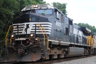 9957