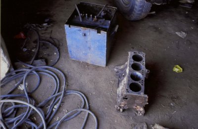 An African Garage in Zambia. The Engine block is sometimes used as an anvil and sometimes rebuilt