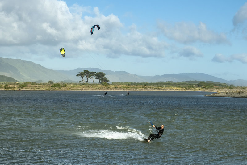 21 May 2022 - Still a strong wind but the sky is a little blue - Wind surfers having a ball