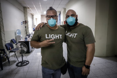 Hands Of GOD photographer John Parra and Pastor Leo Serving at the Policia Nacional Civil prison in San Miguel