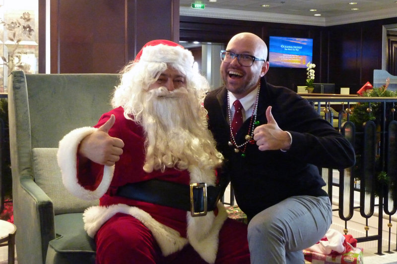 Santa came down the smokestack.  Howard saw him; I was too cozy in the room to go. (Santa with Corey, cruise director).