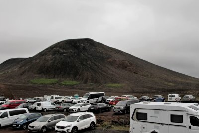 The coach drove past several parking lots filled with volcano seekers