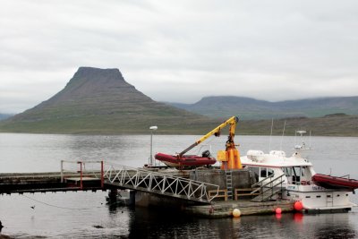 Flat top mountain and Vigur boat Gudron K at the pier (West Tours, transportation)