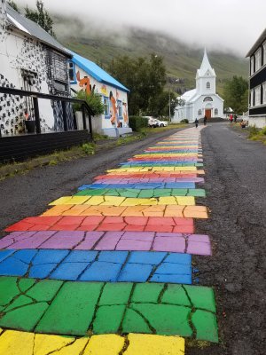 Rainbow street with Blue Church