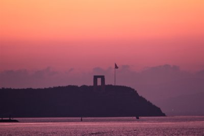 War Memorial as sunrise came & ship went out of strait. Very striking monument. 