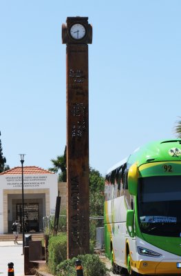 Entrance to Archaeological Park, town clock, and local bus