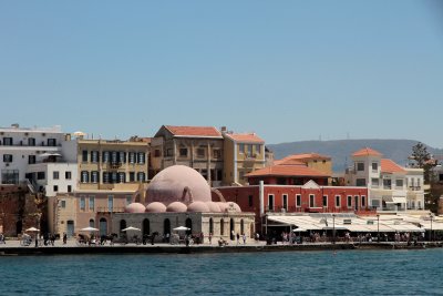 Area across water from lighthouse with cafes, mosque, carriages, Nautical Museum