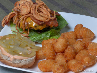 Bacon cheese burger with fried onions and tatertots