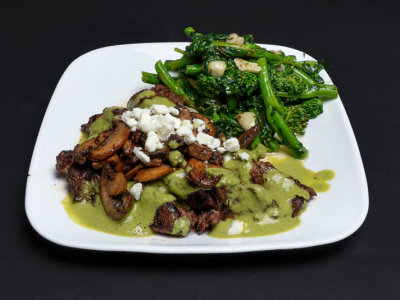 Steak & mushrooms w/ green sauce and feta. Broccoli rabe sauteed in garlic.