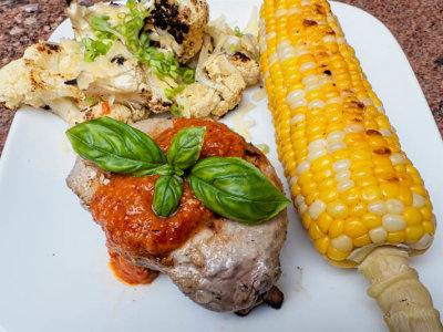 Grilled Pork Loin Chop with Roasted Red Pepper Sauce, Roasted Cauliflower with Gruyere, Grilled Corn  