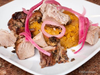 Pernil over Mofongo with Pickled Onions