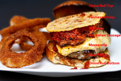 Burger/Hot Italian Sausage/Mozzarella/Marinara/Parmesan Crisp on Onion roll with Onion Rings  