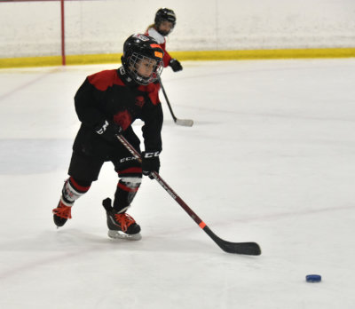AJ going for the puck (1st grade)