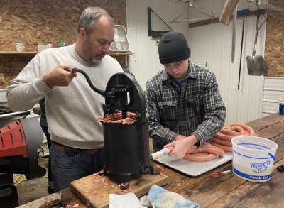 Chad and Nolan making pork sausage