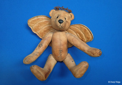 Aged look calico artist bear
