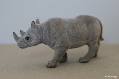 Flocked rhinoceros figurine