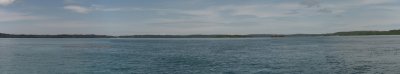 Inside lagoon view heading north with small island resort construction and village.jpg