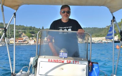 Exploring Paxos coastline with a boat.