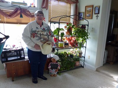 Maralee watering her plants