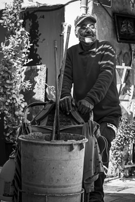 Street cleaner in Akko Turkish Bazaar